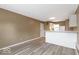 Open-concept living area with a view of the kitchen's breakfast bar at 5420 Mcfarland Rd, Indianapolis, IN 46227