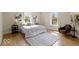 Sunlit bedroom with modern decor, large windows, and a cozy rug at 5420 Mcfarland Rd, Indianapolis, IN 46227