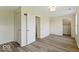 Spacious room with fresh flooring, closet space, and neutral paint scheme at 5420 Mcfarland Rd, Indianapolis, IN 46227