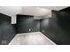 Empty basement space featuring neutral carpet, black walls, and recessed lighting at 5630 Winthrop Ave, Indianapolis, IN 46220
