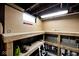Spacious basement workshop featuring ample storage, pegboard walls, and a sturdy workbench area at 5630 Winthrop Ave, Indianapolis, IN 46220