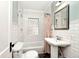 Bathroom with subway tile and a pedestal sink at 5630 Winthrop Ave, Indianapolis, IN 46220