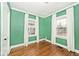 Bedroom with green walls and hardwood floors at 5630 Winthrop Ave, Indianapolis, IN 46220