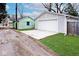 Detached garage with a new concrete driveway and well maintained lawn at 5630 Winthrop Ave, Indianapolis, IN 46220