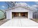 Open detached garage with concrete driveway at 5630 Winthrop Ave, Indianapolis, IN 46220