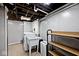 Bright basement laundry room with washer and dryer and exposed ceiling joists at 5630 Winthrop Ave, Indianapolis, IN 46220