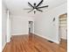 Open living room featuring hardwood floors, large windows, and a ceiling fan for a comfortable ambiance at 5630 Winthrop Ave, Indianapolis, IN 46220