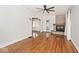 Cozy living room with a stone fireplace, hardwood floors, and lots of natural light at 5630 Winthrop Ave, Indianapolis, IN 46220