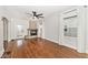 Spacious living room with hardwood floors, a stone fireplace, and large windows for ample light at 5630 Winthrop Ave, Indianapolis, IN 46220