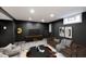 Relaxing living room has a plush sofa, decorative rug, and a modern design at 5630 Winthrop Ave, Indianapolis, IN 46220