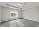 Spacious bedroom with ceiling fan and large window at 6207 Preserve Way, McCordsville, IN 46055