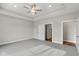Large bedroom with ceiling fan and access to bathroom at 6207 Preserve Way, McCordsville, IN 46055
