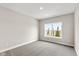 Well-lit bedroom with large window and grey carpet at 6207 Preserve Way, McCordsville, IN 46055