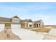 Two-story home with attached garage and landscaping at 6207 Preserve Way, McCordsville, IN 46055