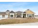 Modern craftsman style home with gray and yellow exterior, and a well-manicured lawn at 6207 Preserve Way, McCordsville, IN 46055