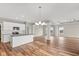Open concept kitchen with island and stainless steel appliances at 6207 Preserve Way, McCordsville, IN 46055