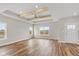Spacious living room with hardwood floors, exposed beams, and lots of natural light at 6207 Preserve Way, McCordsville, IN 46055