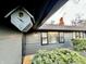 A charming exterior view showcasing the birdhouse and well-manicured landscaping at 6220 Dean Rd, Indianapolis, IN 46220