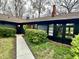Beautiful home exterior featuring a well-manicured garden, a lovely front walkway, and a charming entrance at 6220 Dean Rd, Indianapolis, IN 46220