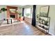 Inviting living room with a decorative brick fireplace, hardwood floors, and an abundance of natural light at 6220 Dean Rd, Indianapolis, IN 46220
