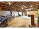 Spacious garage featuring exposed beams and a concrete floor at 9222 W State Road 38, Lapel, IN 46051