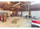The garage is under construction, with plywood walls and an open stud ceiling and a motorcycle at 9222 W State Road 38, Lapel, IN 46051