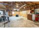 The garage has exposed beams, a concrete floor, and ample space at 9222 W State Road 38, Lapel, IN 46051