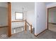 Hallway featuring stairs with wood trim and chandelier lighting at 9222 W State Road 38, Lapel, IN 46051