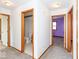 Hallway featuring doors leading to rooms, including the bathroom at 9222 W State Road 38, Lapel, IN 46051