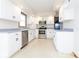 Well-equipped kitchen featuring stainless steel appliances and ample white cabinetry at 9222 W State Road 38, Lapel, IN 46051