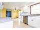 Bright kitchen featuring stainless steel appliances, white cabinetry, and view to backyard at 9222 W State Road 38, Lapel, IN 46051