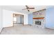 Cozy living room featuring a brick fireplace, open layout, and modern ceiling fan at 9222 W State Road 38, Lapel, IN 46051