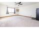 Spacious living room with window, shelving and neutral carpeting at 9222 W State Road 38, Lapel, IN 46051