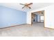 Bright living room with an open floor plan, fireplace and modern ceiling fan at 9222 W State Road 38, Lapel, IN 46051