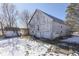 White barn with double doors and small outbuilding in snowy yard at 1112 N Five Points Rd, Greenwood, IN 46143