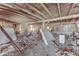 Barn interior with exposed beams and debris on the floor at 1112 N Five Points Rd, Greenwood, IN 46143