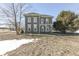 Two-story farmhouse with a large front yard at 1112 N Five Points Rd, Greenwood, IN 46143