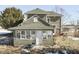 Two story green house with sunroom and detached shed at 1112 N Five Points Rd, Greenwood, IN 46143
