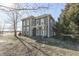 Two-story farmhouse with front porch and mature trees at 1112 N Five Points Rd, Greenwood, IN 46143