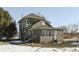 Two story green house with sunroom and detached shed at 1112 N Five Points Rd, Greenwood, IN 46143