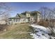 Two story green house with sunroom and detached shed at 1112 N Five Points Rd, Greenwood, IN 46143