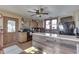 Spacious kitchen with wood cabinets, island, and a ceiling fan at 1112 N Five Points Rd, Greenwood, IN 46143