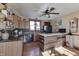 Spacious kitchen with wood cabinets, island, and a ceiling fan at 1112 N Five Points Rd, Greenwood, IN 46143