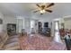 Open living space with a brown couch and hardwood floors at 1112 N Five Points Rd, Greenwood, IN 46143