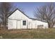 Whitewashed small barn with two doors and a window at 1112 N Five Points Rd, Greenwood, IN 46143
