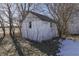 Small white shed with a single window, nestled among trees at 1112 N Five Points Rd, Greenwood, IN 46143