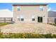 Home's back features a large patio and fenced yard at 13398 N Largo Ct, Camby, IN 46113