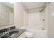 Clean bathroom with a shower/tub combo, tile flooring, and dark vanity at 13398 N Largo Ct, Camby, IN 46113