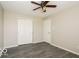 Well-lit bedroom featuring wood-look floors, ceiling fan, and ample closet space at 13398 N Largo Ct, Camby, IN 46113