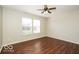 Spacious bedroom with hardwood floors, large windows, and a ceiling fan at 13398 N Largo Ct, Camby, IN 46113
